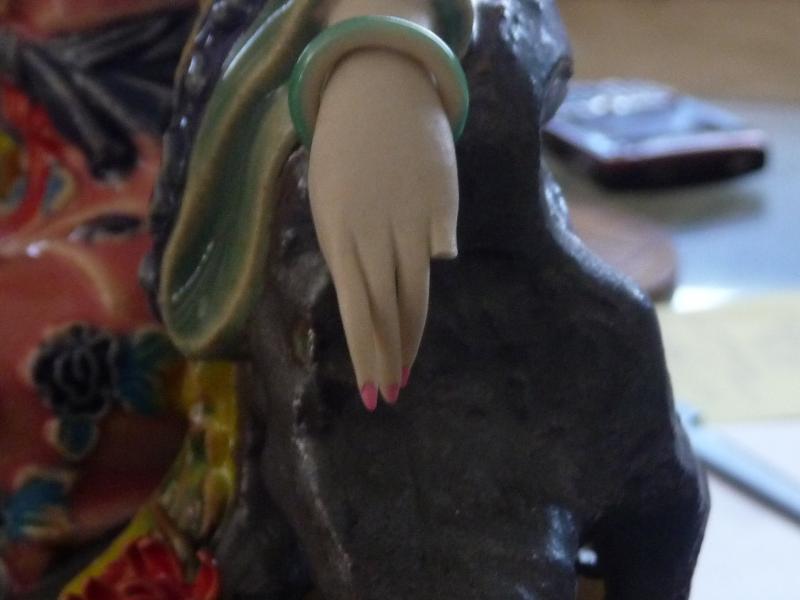 Chinese figurine. Before Treatment.